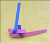 Bring the bottom vertical strip (on the right) up through the loop you created in the last step