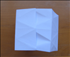 Flip over the paper to the other side
Bring the ends together and insert one side into the pocket