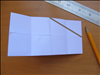 Fold the paper in half. There should be 8 squares and the flaps facing inside
Draw a line from the center of the top to the center of the right side