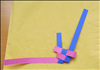 Insert the right horizontal strip into the loop that is between the 2 vertically ends