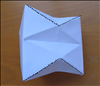 Push down and in the top and bottom rows of triangle all around
Crease them