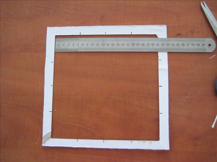 Use your ruler to find and mark the middle of each of the 4 sides.

Make a halfway mark between the middle and the end of the opening  to divide each side into 1/4 's. 