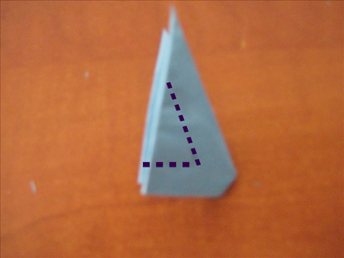 Using the midpoint of the 2 right bottom edges,  carefully cut out a small triangle. 

* Pay attention that the widths remaining on right and bottom are equal
