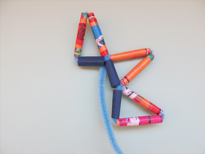 Twist the pipe cleaner around the end of the triangle next to it.