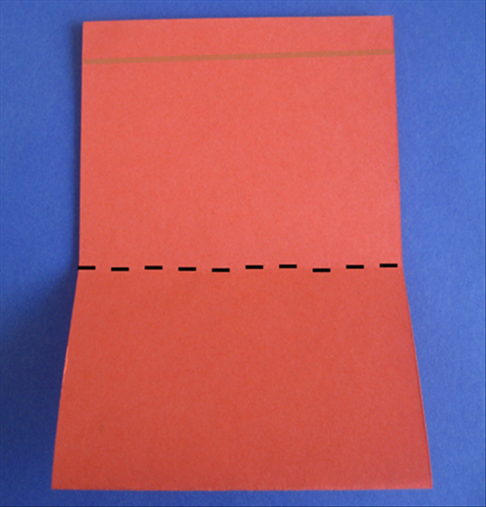 Place the paper with the open end at the top
Fold the bottom edge up to ¼ inch below the top
