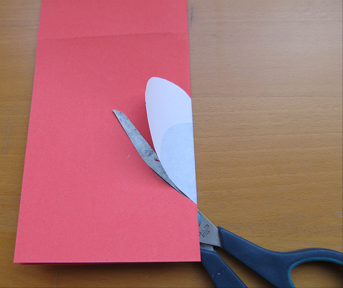 Use the heart as a guide to cut out a heart.  Leave a connecting area. See the next picture showing a yellow line where not to cut before you begin cutting