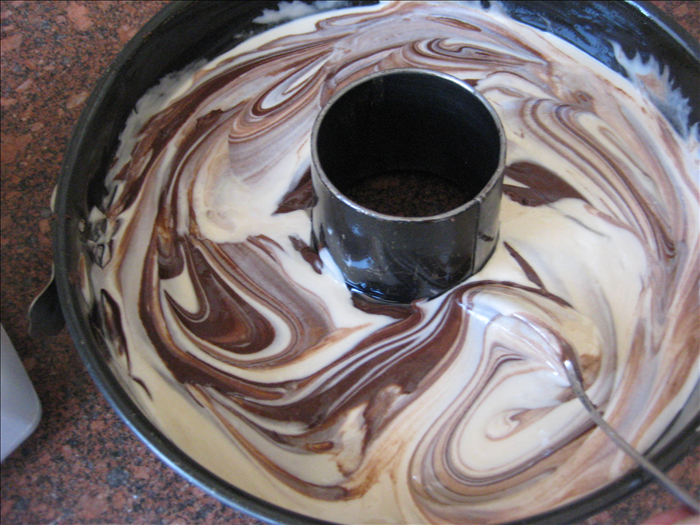 Slightly mix the cocoa layer into the batter – not enough to blend completely just enough to make swirls. 