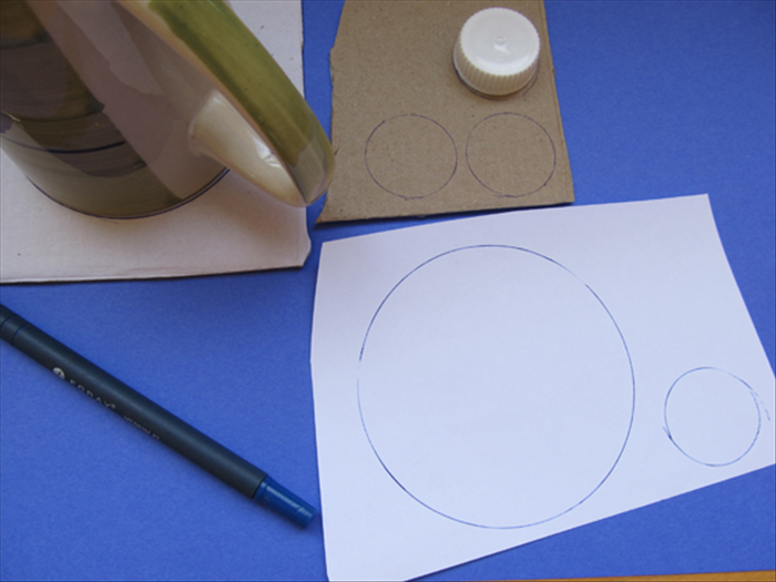 Trace the bottle cap 3 times on the cardboard and one time on scrap paper

Trace the coffee cup 1 time on the cardboard  and 1 time on the scrap paper

Cut out the circle shapes
