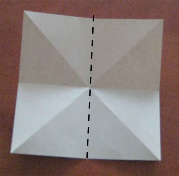 Fold the paper in half vertically. Unfold