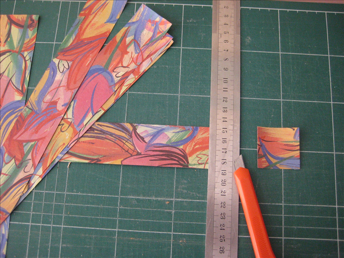 Cut your scrap paper into  32 squares  measuring 1 ½ inches X 1 ½ inches