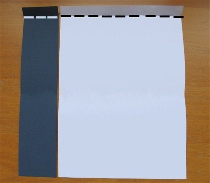 <p> Place both papers with the short edges at the top and bottom.</p> 
<p> Make a 1 inch fold at the top of both papers. Unfold</p>