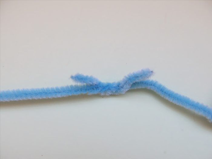 Add another pipe cleaner by twisting the ends together