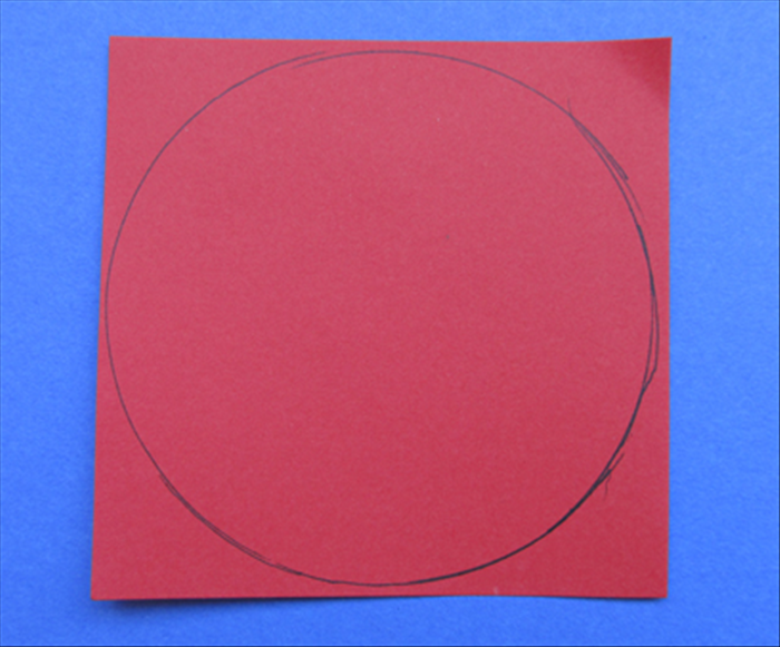 Draw a circle on the paper

The finished hat will be about ¼ less than the diameter of the circle
For this guide a circle 20 inches wide was used for a large adult size hat.
To draw a large circle see the guides on how to draw circles of any size.
