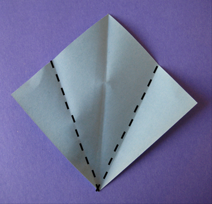 Fold the bottom sides up to align with the center crease.