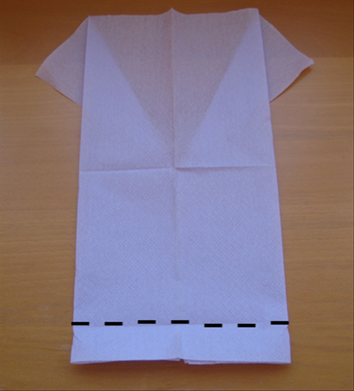 Flip over the napkin to the back side.

Make a  fold about 1 inch from the bottom. This will be the width of the collar.
