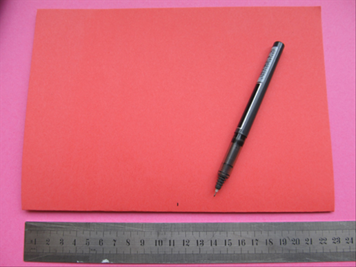 Place the folded  8 ½ inches X 12 inches paper  with the folded edge at the bottom.

Mark the middle point
