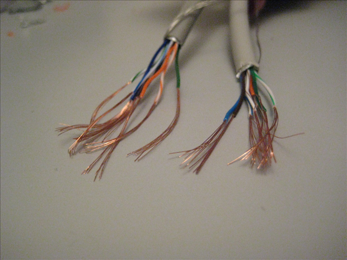 Gently peel off the casing.Try not to break the copper wire inside.

Do that to of the colored casings
including the ones in the extension cable.