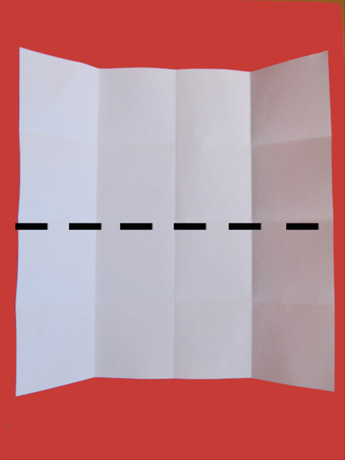 Bring the bottom edge up to the top edge  to fold the paper in half