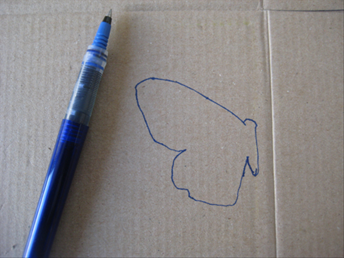 Draw the body and 1 wing on a piece of cardboard.