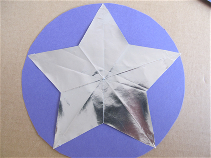 <p> Glue the star to the center of the circle.</p> 
<p>  </p>