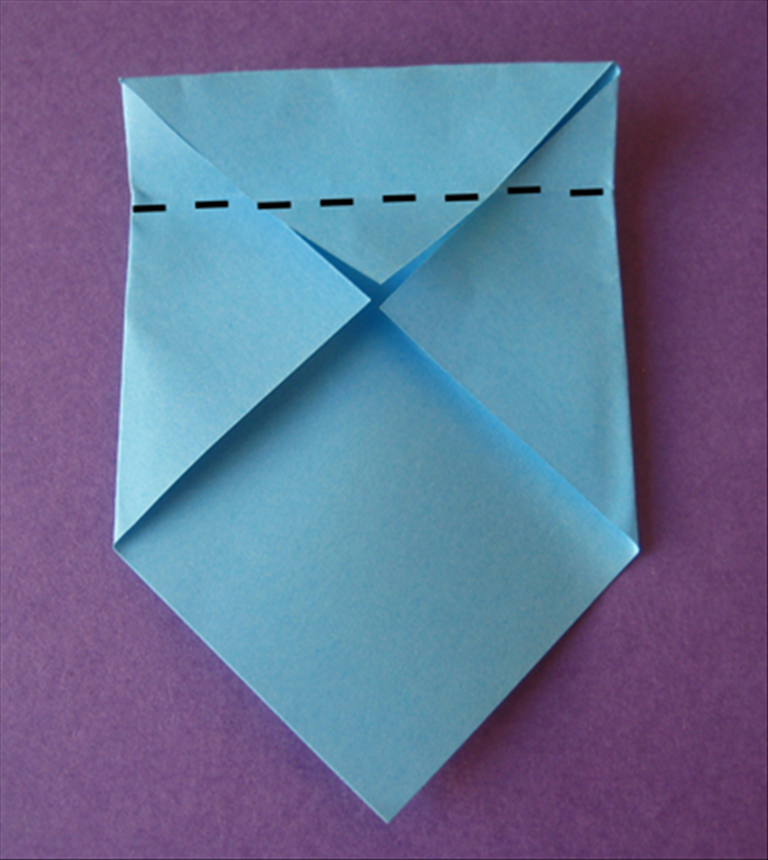 Fold the top edge down to the center and crease it.
