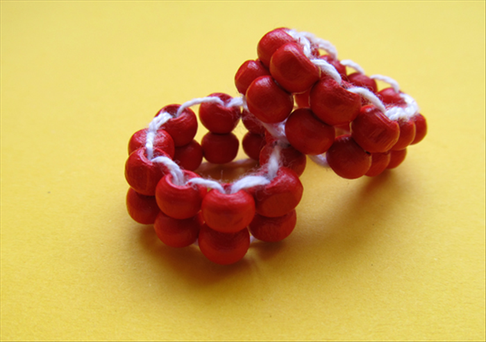 To make a bead ring you will need:
About 32 inch long string  - strong thread or elastic thread
Needle
Beads -18 large beads were used for the guide. This is good for children or to learn the process but smaller beads look more elegant and you will needs at least 4 times as much
Scissors
