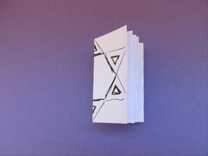 Use the fold as a guide to make to accordion fold the strip of paper