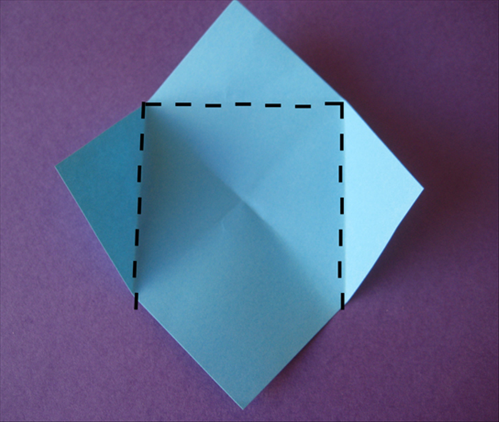 Turn the paper so that the points are at the top, bottom and sides
Fold the top and side points to the center crease mark
Do not fold up the bottom point

