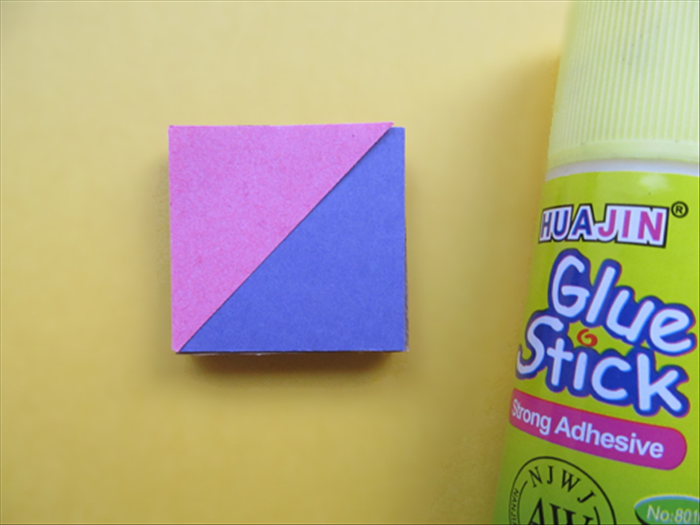 <p> Carefully align the triangle to the edges and center of the square and glue it in place.</p>  
<p>  </p>