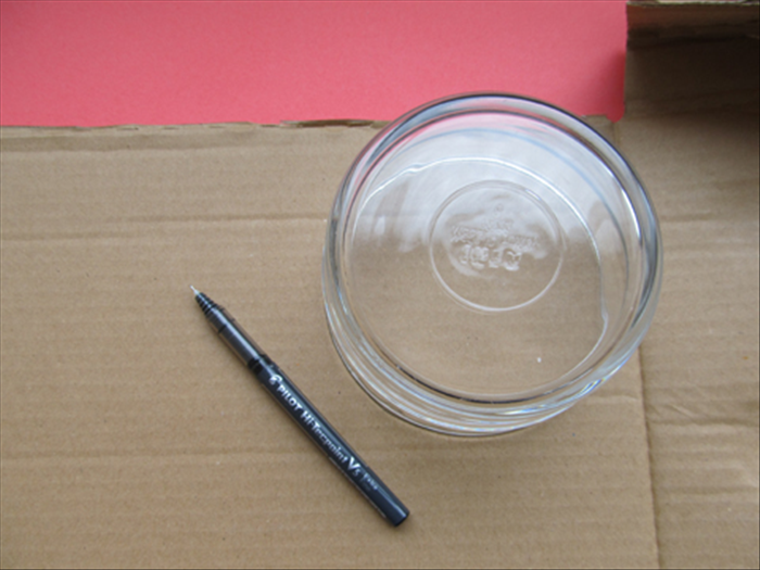 Trace the outline of the 4 ½ inch circular object on the top right side of the cardboard