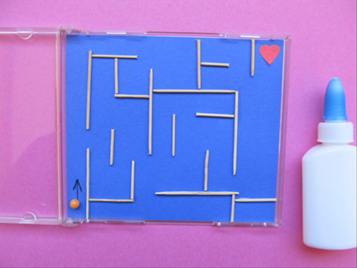 Cut different lengths and glue them to the paper to make a maze.
Draw an arrow at the start of the maze and glue a picture that represents a prize at the goal.
You can cut out pictures from magazines or junk mail to glue to the maze.
