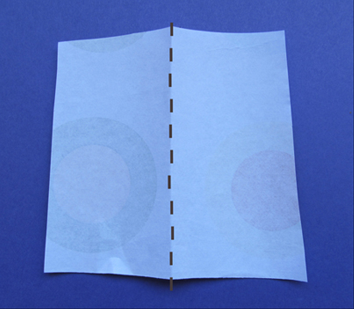 See step 6 for approximate size of the scrap paper.

Fold the scrap paper in half.