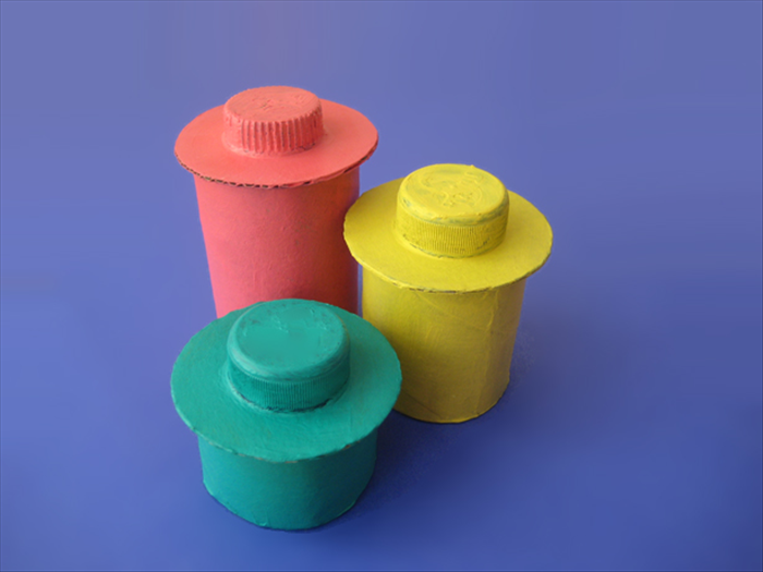 Materials:
Toilet paper roll
Thick cardboard for the box cover
Thin cardboard for the bottom
Small bottle cap
Plastic glue
Scissors
Pen
1 round object  with a diameter slightly smaller than the toilet paper roll diameter
1 round object with diameter slightly larger than toilet paper roll diameter
