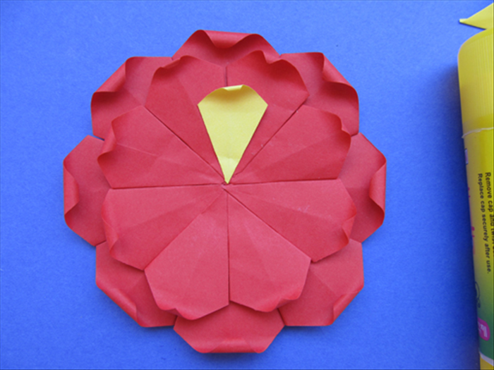 Glue the 3rd row the same way with it centered between the 2 petals below it.