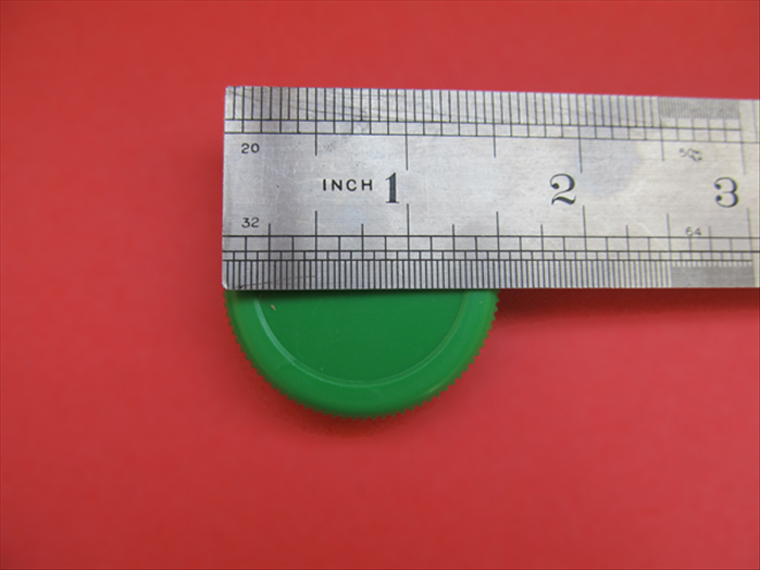 Find a 1 ½ inch diameter round object 
(or draw one with a compass and cut it out)

*A bottle cap from an orange juice bottle was used in this demonstration.