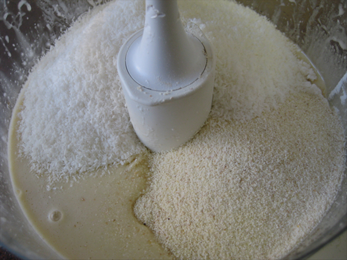 Add  the ½ cup flour, baking powder, semolina and coconut and mix only until smooth