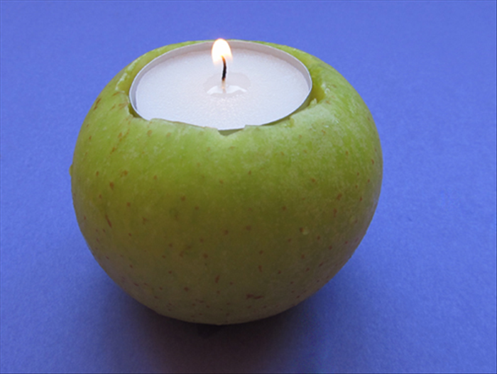 Materials: 
apples
candles
sharp knife
toothpick 