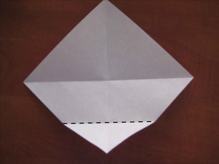 Fold the bottom point to the center.
Fold the 3 other points to the center also.