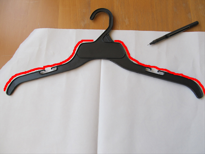 Trace the top outline of the hanger as shown in red in the picture
