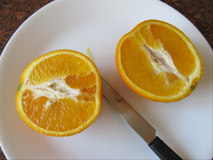 Cut the orange in half