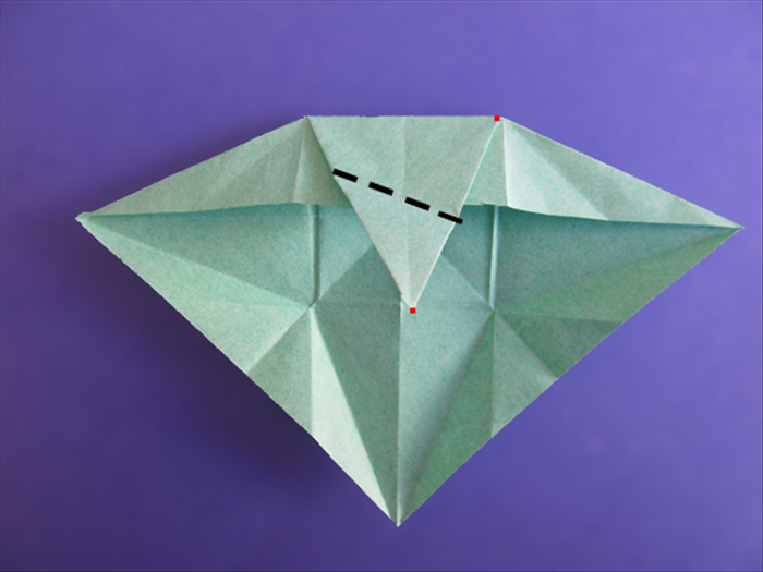 <p> Don’t unfold the last side.</p> 
<p> Rotate the paper.</p>  
<p> Fold the tip to the top right point of the triangle. Make sure the sides are aligned.</p>  
<p>  </p>