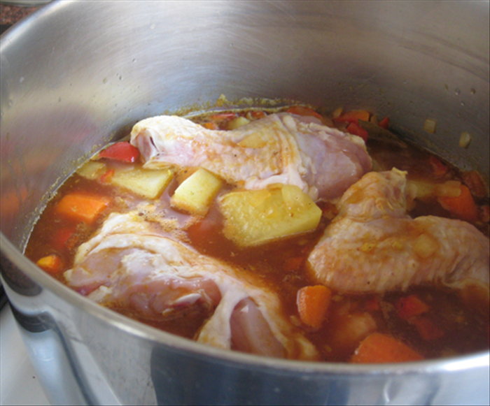 Add the chicken, potatoes and carrots
Bring to a boil

Lower to a medium flame and cover the pot
Cook 20 min or until you can stick a fork into the potatoes and carrots and the chicken is cooked
