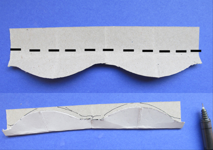 Unfold the strip you just cut
Fold it in half lengthwise and trace the curved edge
