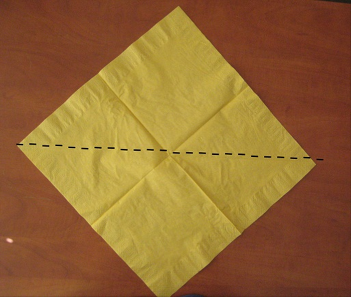 Unfold the napkin
Bring the bottom point up to the top to fold it in half.