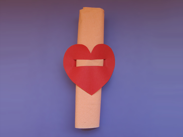 Slide the heart to the middle of the napkin roll.
That’s it! 
