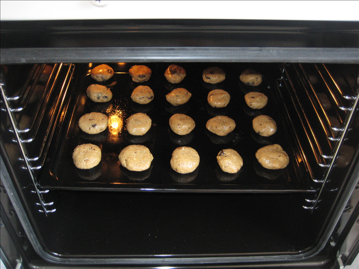 Wet your hands a little to prevent the dough from sticking to them and make balls from a tablespoon of dough.
Place them on a slightly greased baking sheet

Bake  for 10 -12 minutes until golden brown.
