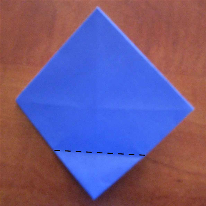 Flip the paper to the back side.
Fold all the corners to the center again