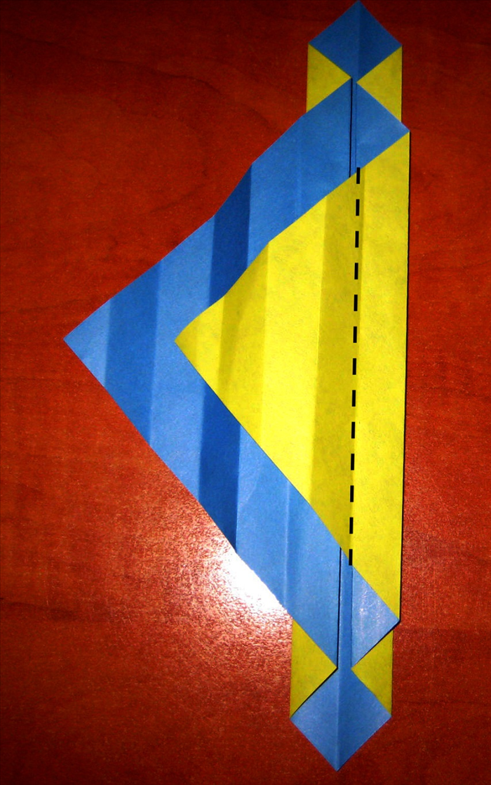 Fold it back again to the right along the crease that aligns with the center.