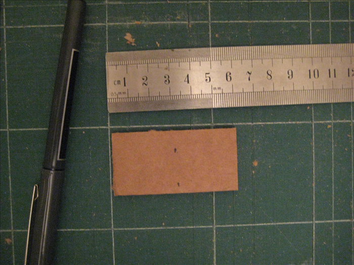 Place the  rectangles with the short ends at the sides. Measure and mark the middle as shown in picture. 