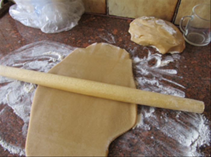 Roll out the dough to about ¼ inch thick with a floured rolling pin on a flour surface